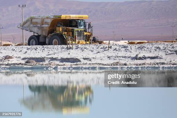 Mining trucks load lithium sulfate, is seen in Atacama Salt Flat, Chile, on July 29, 2024. Chile is the world's leading lithium mining and exporting...