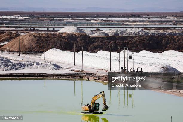 Mining trucks load lithium sulfate, in Atacama Salt Flat, Chile, on July 29, 2024. The South American country seeks to become the main lithium...