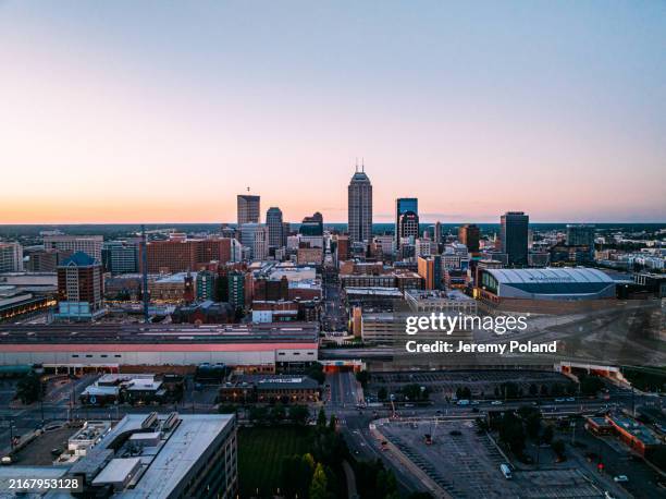 train station south of downtown indianapolis, indiana skyline at sunset - indianapolis stock pictures, royalty-free photos & images