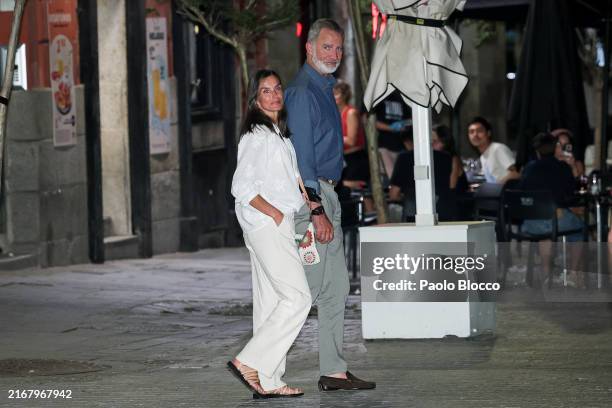 Queen Letizia of Spain and King Felipe VI of Spain are seen leaving an intimate dinner at La Lonja del Mar restaurant on August 22, 2024 in Madrid,...