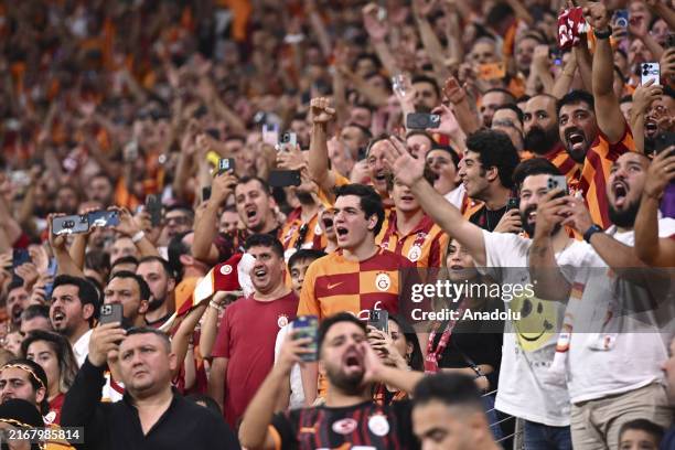 Fans of Galatasaray support their team during UEFA Champions League play-off second leg match between Galatasaray and Young Boys at RAMS Park in...