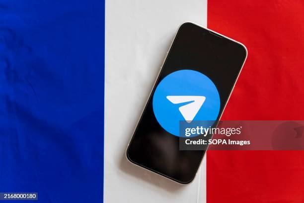 In this photo illustration, a Telegram logo seen displayed on a smartphone with the French flag in the background. Russian born Pavel Durov, CEO of...