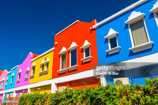 colourful building facade, willemstad, curacao - blue curacao stock pictures, royalty-free photos & images