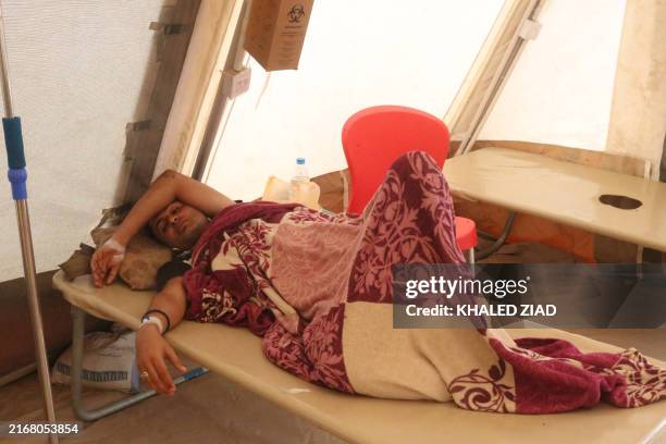 Cholera patients receive treatment at a clinic in the Hays region, south of Yemen's Hodeidah Governorate on August 21, 2024. Clinics in western Yemen...
