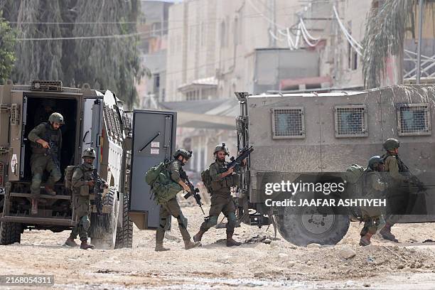 Israeli soldiers operate during a raid in the Nur Shams camp for Palestinian refugees near the city of Tulkarem in the Israeli-occupied West Bank on...
