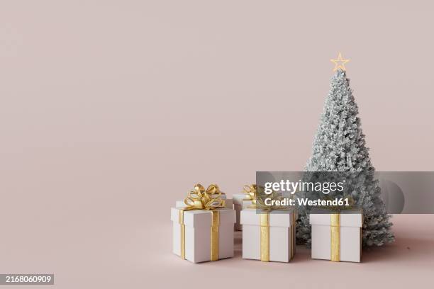 3d render of christmas tree with gifts against pink colored background - cone shape stock illustrations