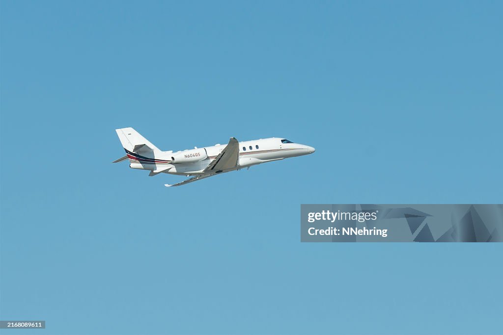 Cessna 680A Citation Latitude jet airplane in blue sky