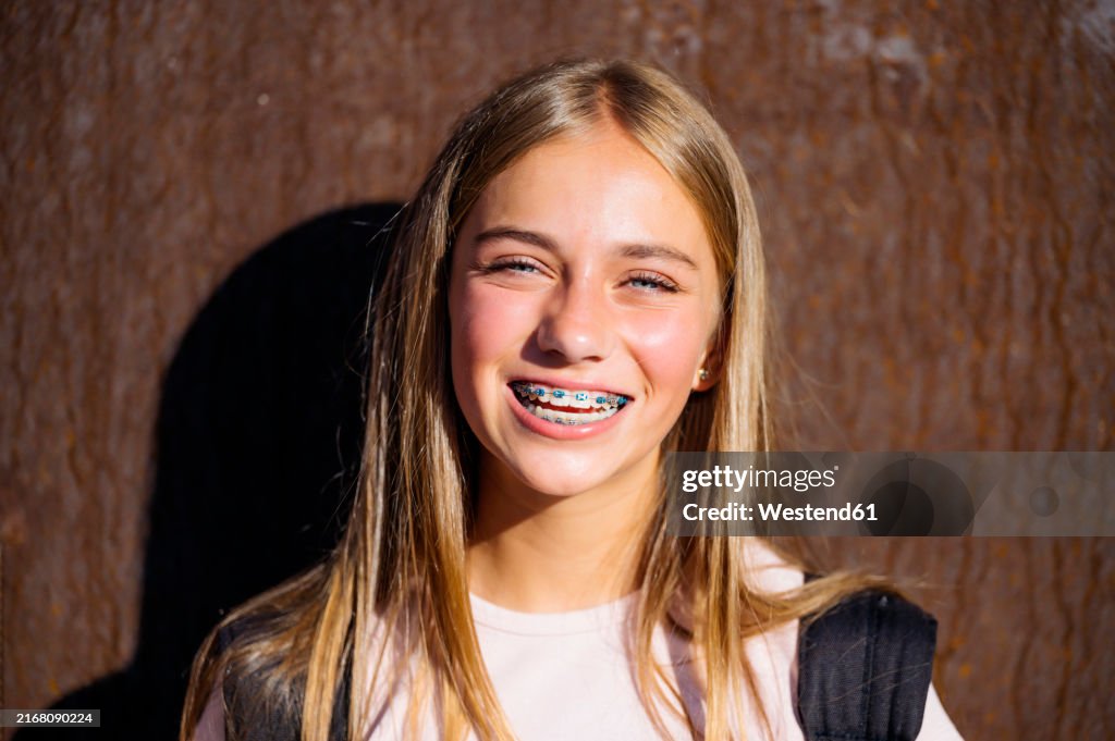 Blond hair girl with dental braces
