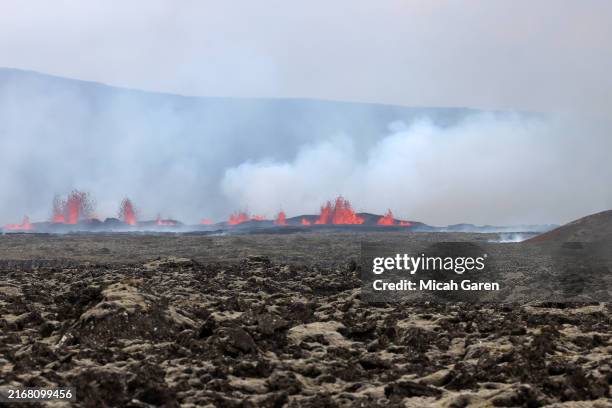 Tourists visit a volcanic eruption on the Reykjanes peninsula on August 23, 2024 in Grindavik, Iceland. The volcano on the Reykjanes peninsula has...