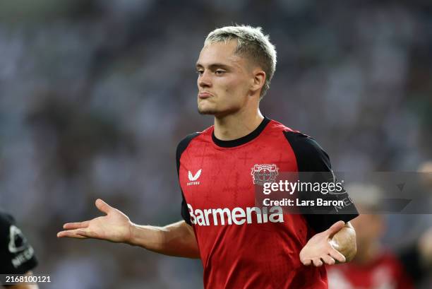 Florian Wirtz of Bayer 04 Leverkusen celebrates scoring his team's second goal during the Bundesliga match between Borussia Mönchengladbach and Bayer...