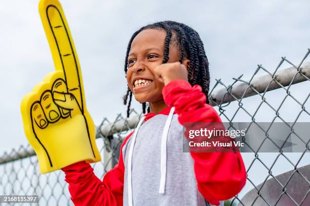 happy young sports fans excited at the game - foam hand stock pictures, royalty-free photos & images