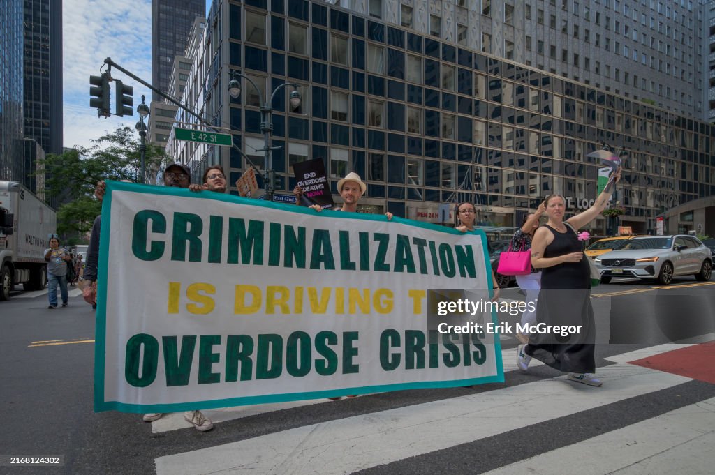 Participants seen holding a banner at the protest. In honor...