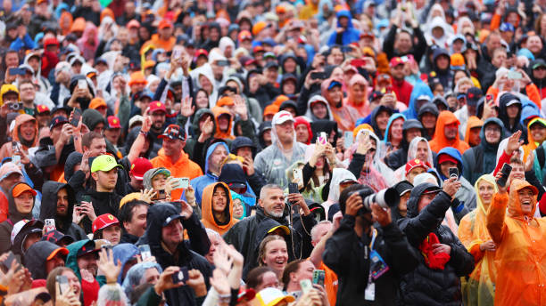 Spectators watch drivers talk on the fan stage prior to final practice ahead of the F1 Grand Prix of Netherlands at Circuit Zandvoort on August 24,...