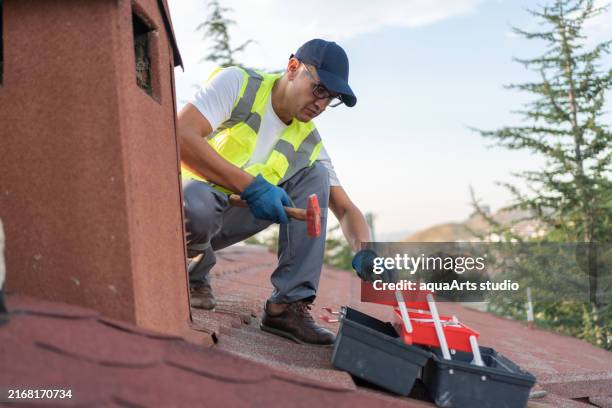 repairing old chimney on the roof of house - asbestos stock pictures, royalty-free photos & images