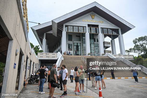 Members of the media stand outside court on the ruling day for the trial of Daniel Sancho Bronchalo, who is accused of killing Colombian plastic...