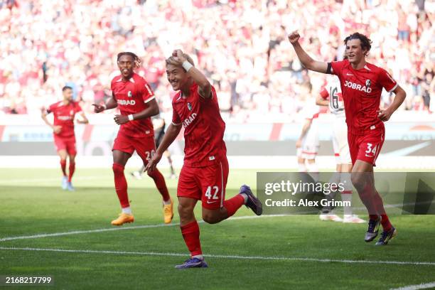 Ritsu Doan of Sport-Club Freiburg celebrates scoring his team's second goal during the Bundesliga match between Sport-Club Freiburg and VfB Stuttgart...