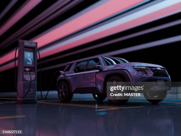 charging an electric car in a futuristic studio - charging sports stock pictures, royalty-free photos & images