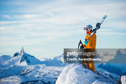 Portrait of young woman skier on mountain top Portrait of young woman skier on mountain top