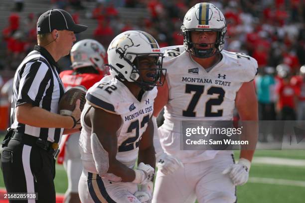 Running back Scottre Humphrey and offensive tackle Conner Moore of the Montana State Bobcats celebrates after Humphrey scored the game-winning...