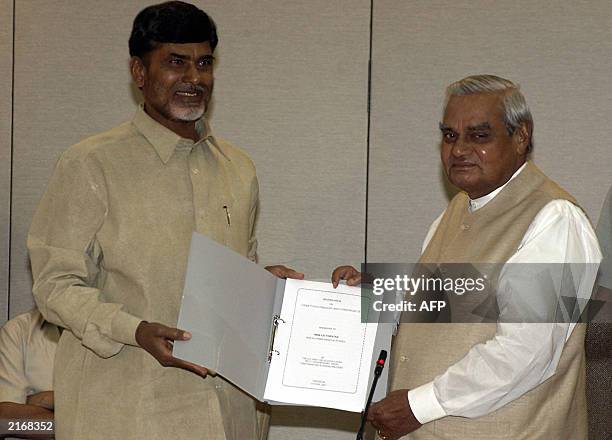 Andhra Pradesh Chief Minister and main supporter of the National Democratic Alliance government Chandrababu Naidu present a memorandum to Prime...