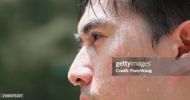 closeup asian man face sweating - suor imagens e fotografias de stock