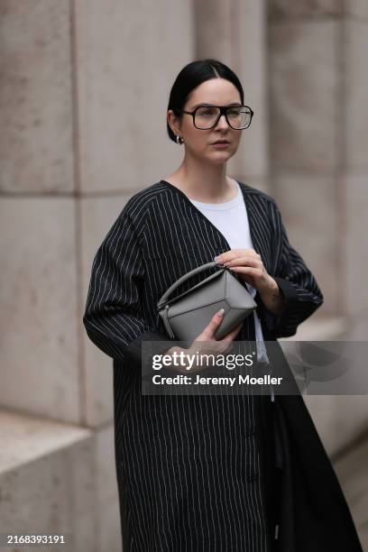 Maria Barteczko seen wearing Victoria Beckham black oversized aviator glasses, WENDYKEI white cotton classic t-shirt, WENDYKEI black pinstriped...