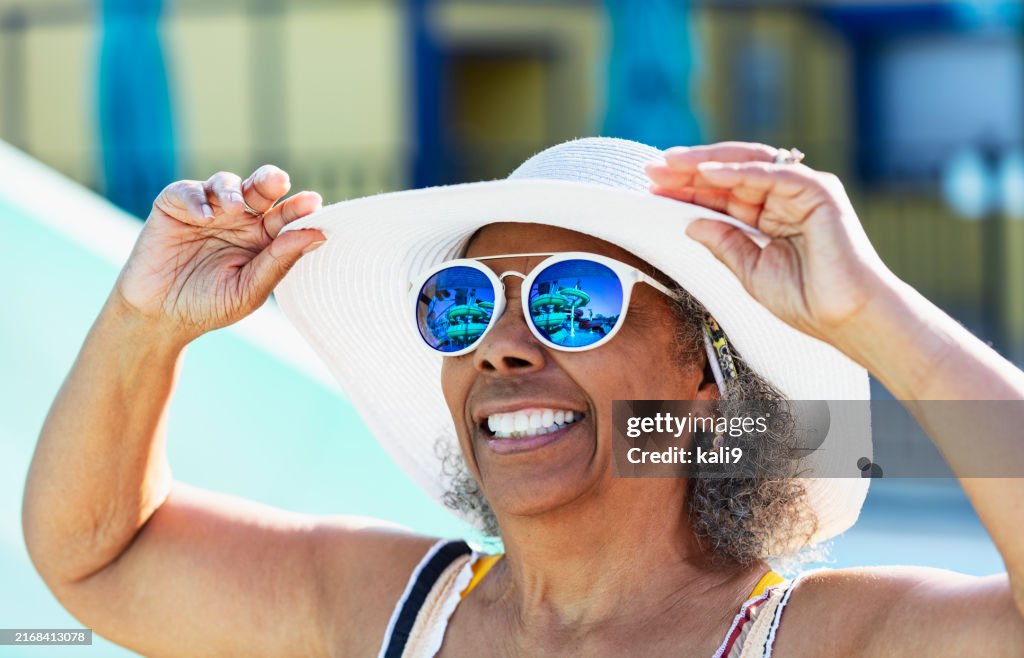 Senior African-American woman wearing hat and sunglasses