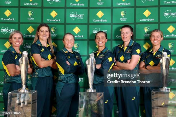 Beth Mooney, Annabel Sutherland, Alyssa Healy, Ashleigh Gardner, Tahlia McGrath and Phoebe Litchfield pose with their winning T20 World Cup trophies...