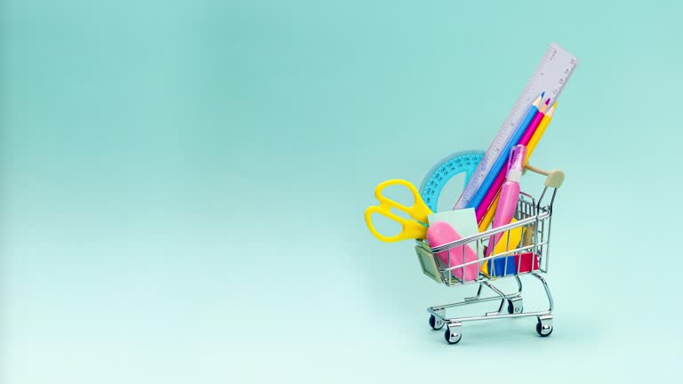 https://media.gettyimages.com/id/2168507381/video/shopping-cart-with-school-supplies-on-blue-background-preparing-for-school-buying-stationery.jpg?b=1&s=640x640&k=20&c=-A5nhYp29pCCFZlfAz-Y1tuhWM6QfIMMGs9BeI3uuAs=