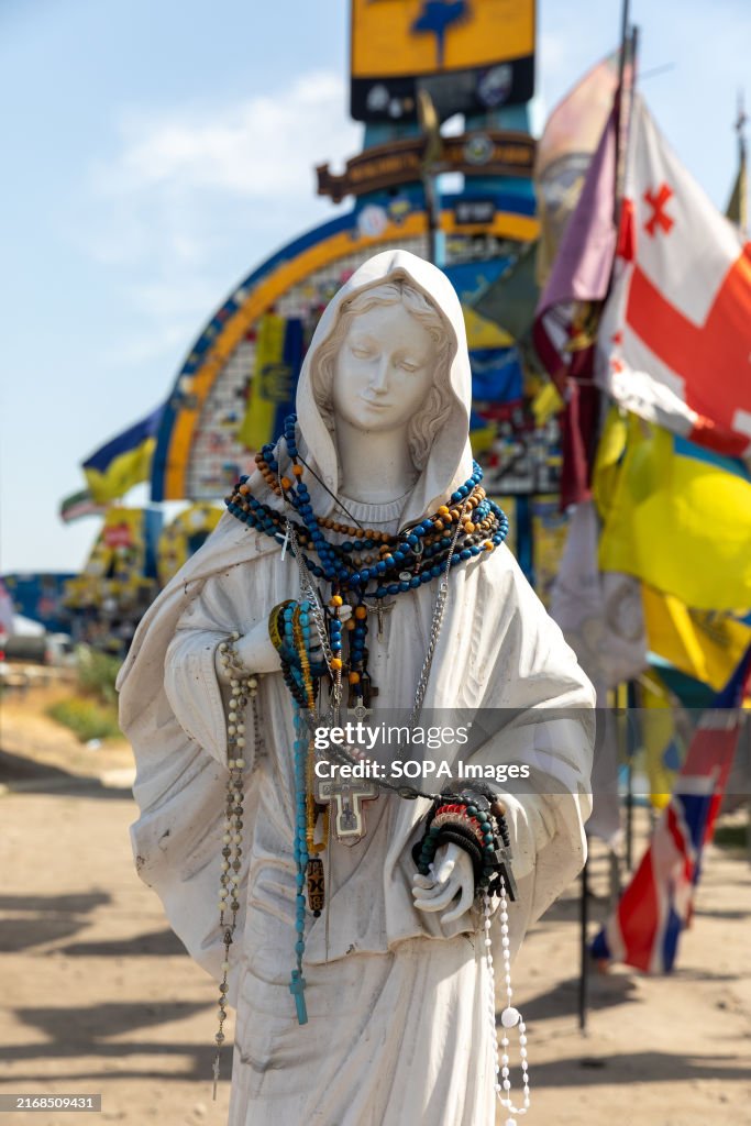 Statue of the Virgin Mary and flags of the brigades...