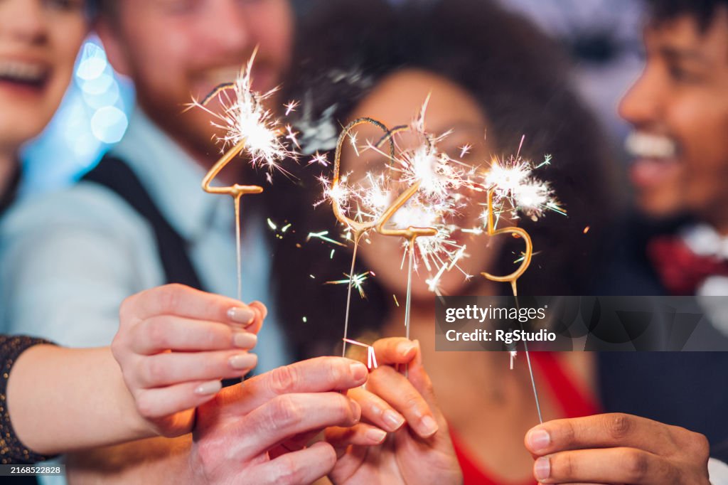 Two couples with sparklers