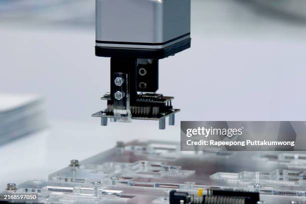 automatic robot for printed circuit board (pcb) assembly machine - computer chip close up stock pictures, royalty-free photos & images
