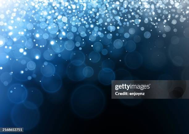 sparkling glittering blue christmas lights vector illustration - string lights on black stock illustrations