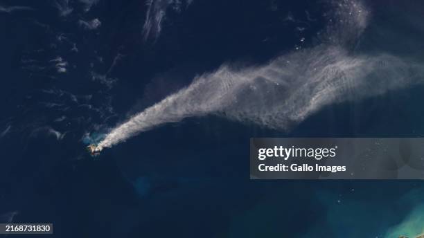 Satellite view of Whakaari White Island volcano erupting off the coast of Whakatane, New Zealand. The eruption has caused significant disruptions,...