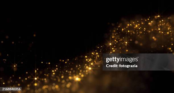 golden glittery particles background with copy space - glowing dust particles stock pictures, royalty-free photos & images