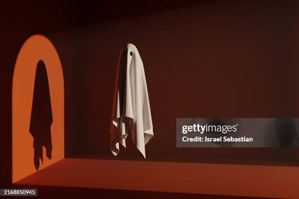 spooky ghost in minimalist orange room setting - fantasma foto e immagini stock