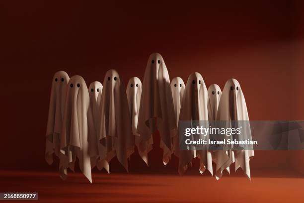 group of white ghosts floating on halloween night - fantasma imagens e fotografias de stock