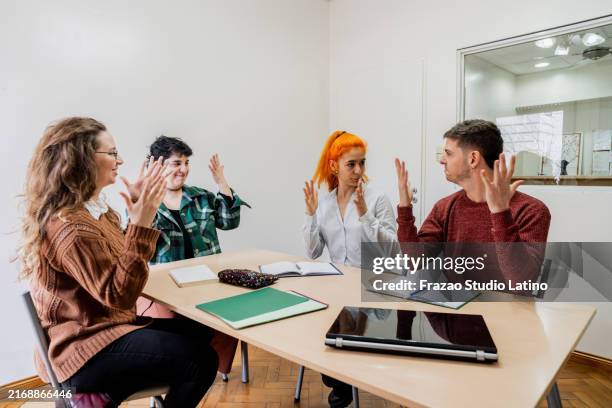 group of people learning sign language - group of people using sign language stock pictures, royalty-free photos & images