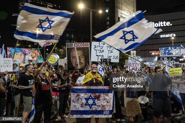 Israeli people, holding Israeli flags and banners, stage a demonstration demanding hostage swap deal and Israeli Prime Minister Benjamin Netanyahu's...