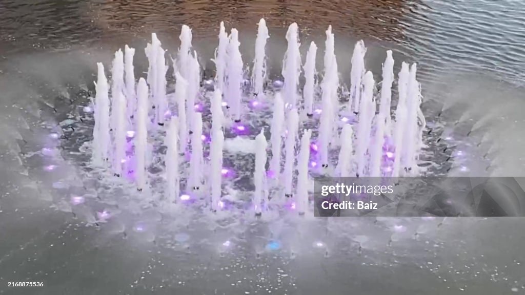 Purple lit water fountain, Katowice, Poland