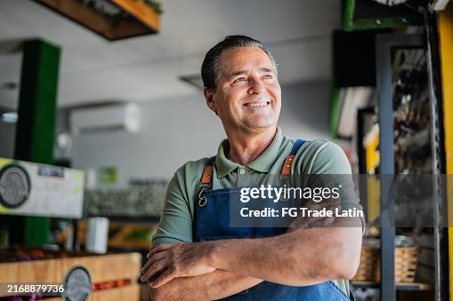 Senior man working and contemplating at store Senior man working and contemplating at store