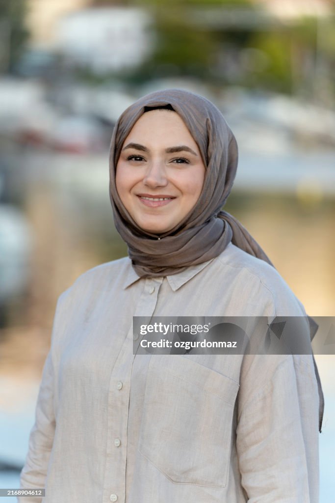 Muslim young woman posing for the camera with a happy mood