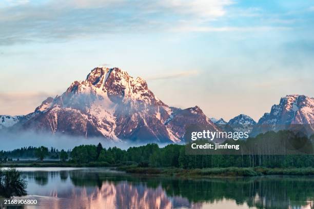 grand teton mountains from oxbow bend on the snake river at sunrise. grand teton national park, wyoming, usa - jackson hole stock pictures, royalty-free photos & images