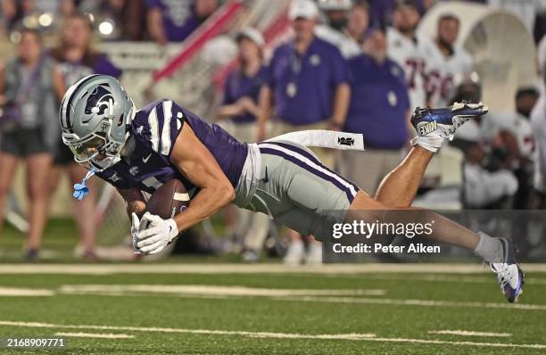 Wide receiver Jayce Brown of the Kansas State Wildcats catches a pass for a first down in the second half against the Tennessee Martin Skyhawks at...