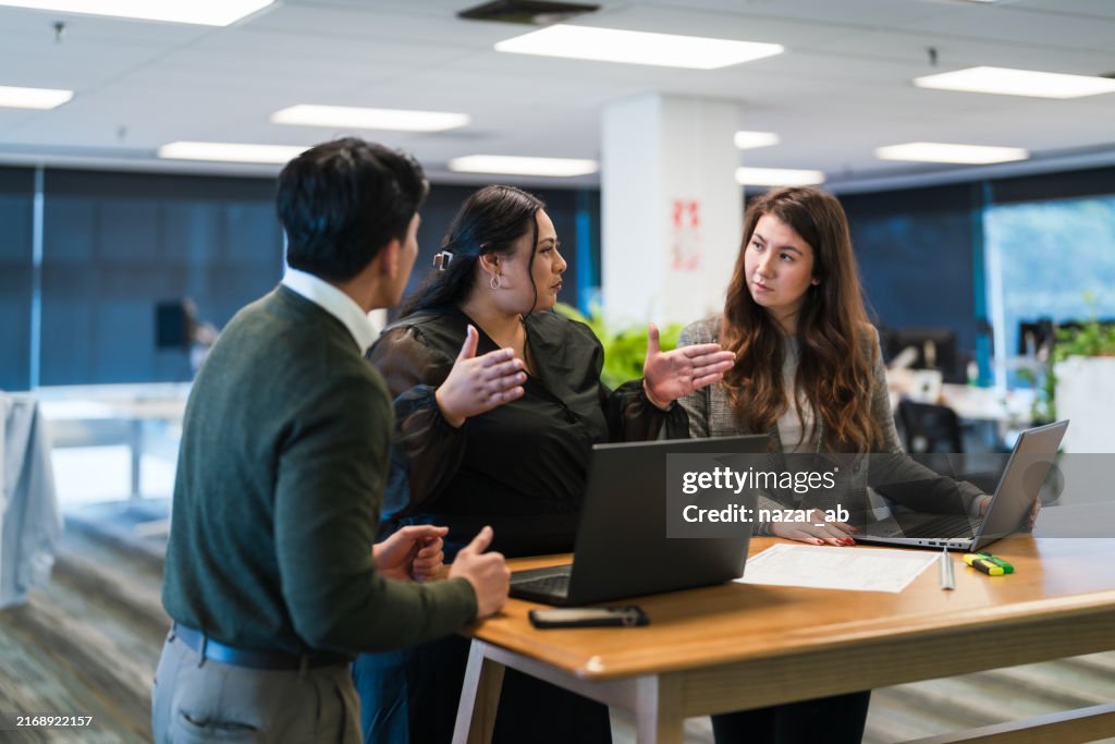 Partnership and collaboration in office, group discussion for feedback.