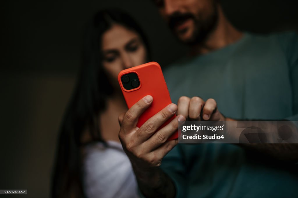 Jelous woman checking a man