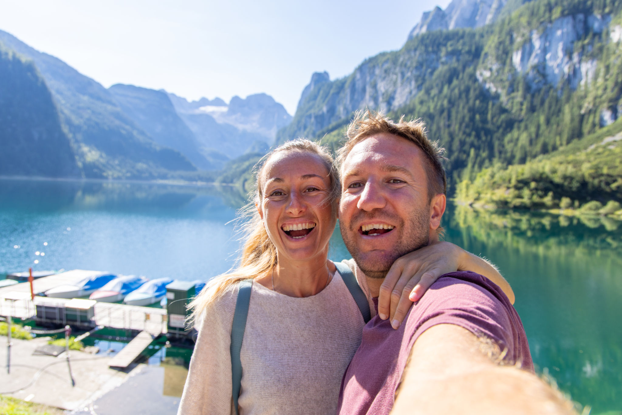 Captured Moments: Smiling Couple Taking a Selfie by the Mountain Lake Captured Moments: Smiling Couple Taking a Selfie by the Mountain Lake
