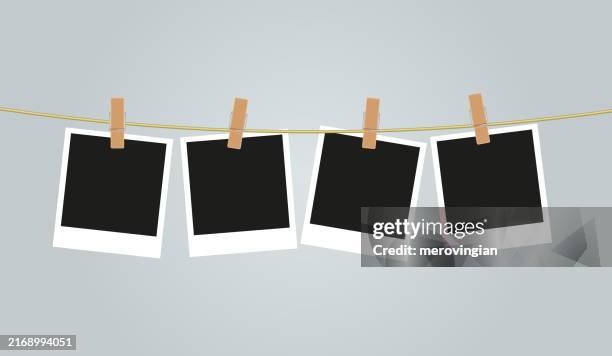 photograph frames hanging on a string - binder clip stock illustrations