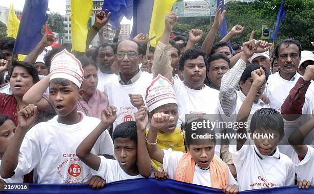 Bangladeshi activists from the National Council of Textile Garment and Leather Workers shout slogans during a demonstration in Dhaka, 27 June 2003....