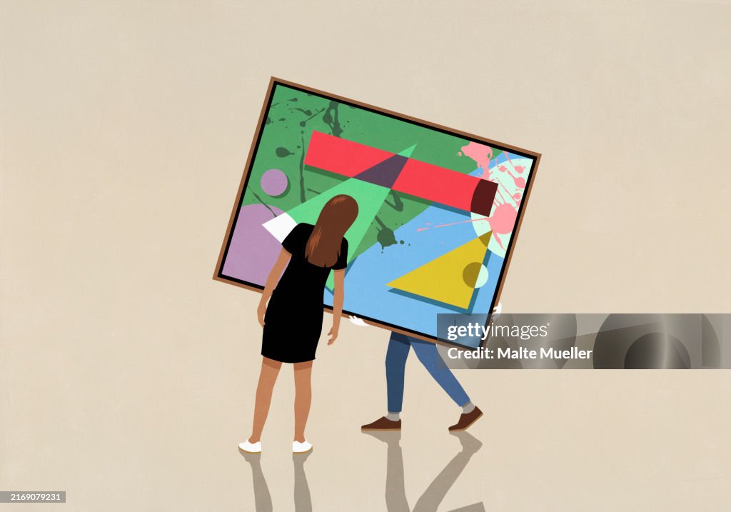 Woman looking at person moving large, abstract painting